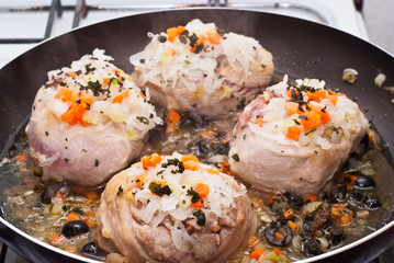 veal shank cooking in pan