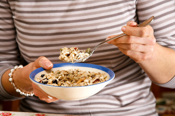 woman's hands holding muesli