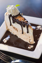 Butterfinger ice cream pie with chocolate sauce