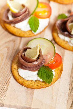 Canapes with pickled anchovy filet