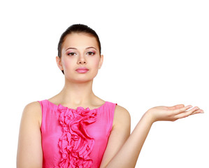 A young woman pointing at something