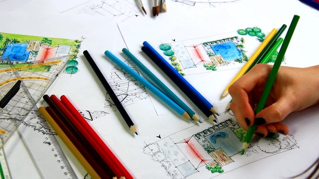 Woman landscape architect working on new plan.