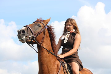 Obraz premium Girl and horse portrait on sky background