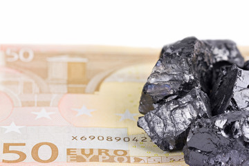Fifty euro banknote whith raw coal nuggets on it