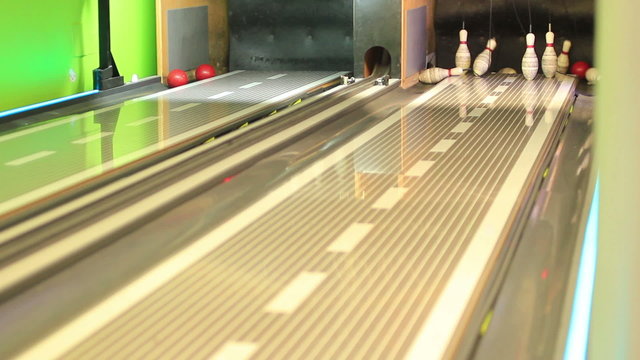 Young guys playing bowling