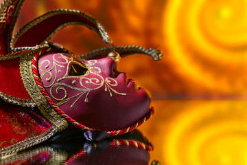 mask with bells on a mirror table