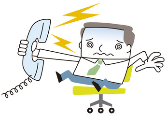 クレームの電話にでるビジネスマン