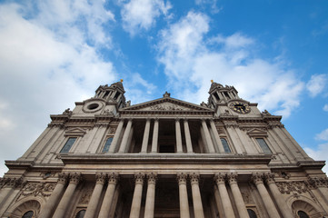 St Paul's Cathedral in London, against a cloudy blue sky.
