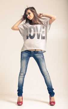 Woman wearing jeans and t-shirt with an inscription love
