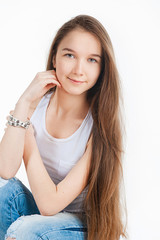 Portrait of beautiful teen girl, on a gray background