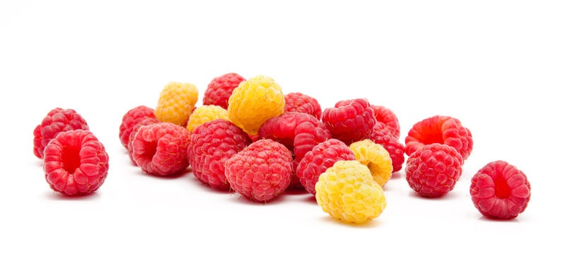 Heap of red and yellow raspberry isolated