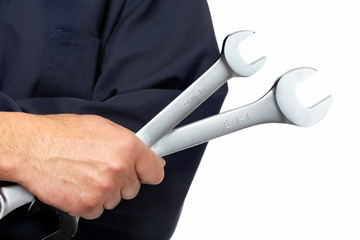 Hand of auto mechanic with wrench.