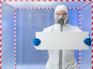 scientist holding ad banner in quarantine chamber