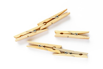 Five wooden clothespins isolated on white background
