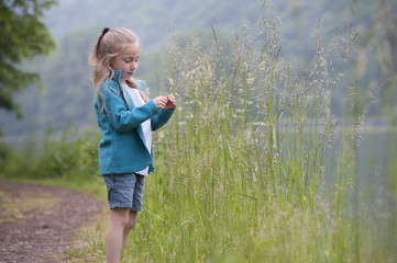 summer holidays: young girl outdoors in nature