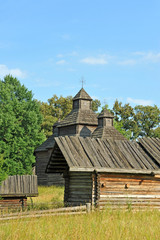 Fototapeta na wymiar Ancient traditional ukrainian rural wooden barn and church