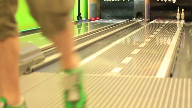 Young guys playing bowling