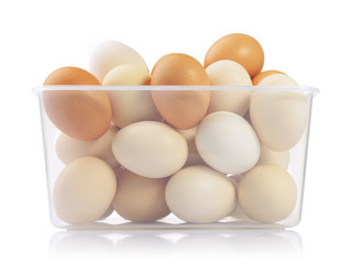 Eggs in plastic box isolated on white background