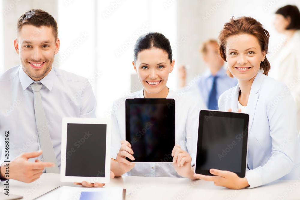 Sticker business team showing tablet pcs in office