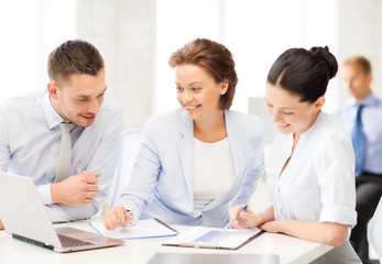 business team discussing something in office