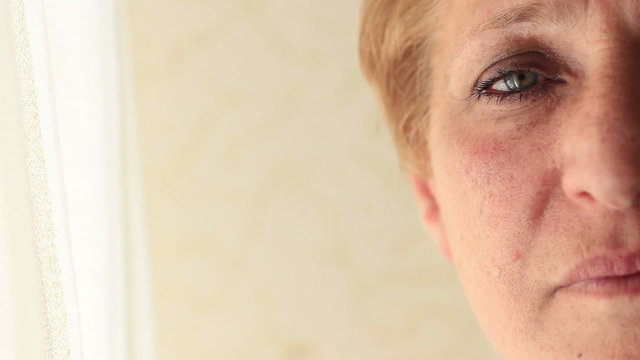 Portrait Of Aged Woman Over White Background