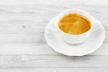 cup of coffee on a wooden table