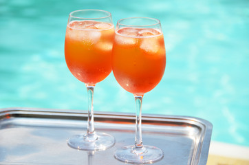 Pair of traditional Italian Spritz cocktails at the swimming poo
