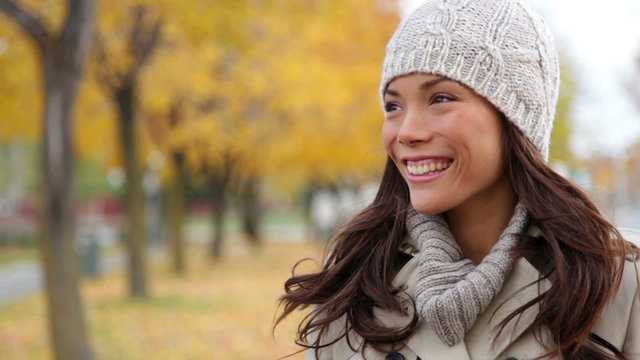 Fall woman looking to side then waving hello