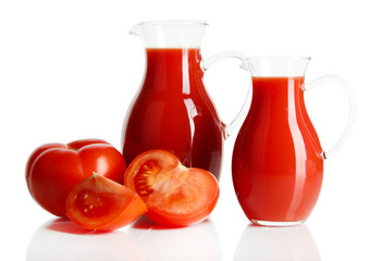 Tomato juice in pitchers isolated on white
