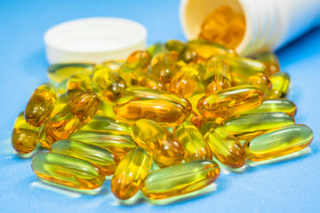 Yellow soft gelatin capsules