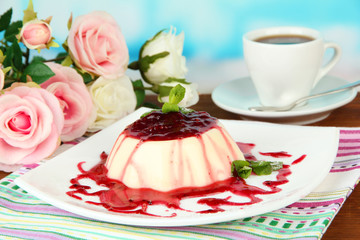 Panna Cotta with raspberry sauce, on bright background