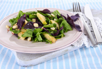 Light salad on plate on napkin