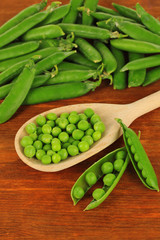 Sweet green peas on wooden background