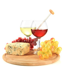 Glasses of wine, tasty blue cheese and grape