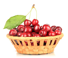 Cherry berries in wicker basket isolated on white