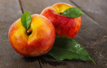 Peaches on wooden table