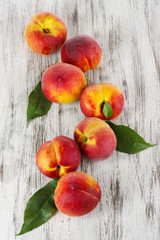 Peaches on wooden table