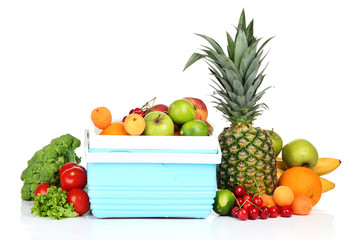 Fresh fruits and vegetables in mini refrigerator, isolated