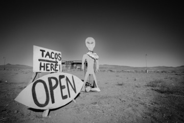 Alien and a Taco Shop SIgn