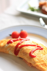 japanese food, omelette rice with ketchup on top