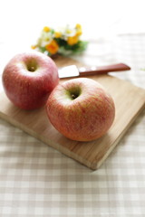 freshness Fuji apple on wooden cutting board with fruit knife