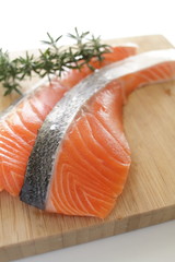 close up of freshness salmon fillet fish on wooden board