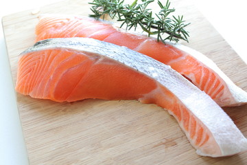 close up of freshness salmon fillet fish on wooden board