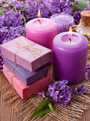 Fototapeta na wymiar Handmade soap, candle and lilac