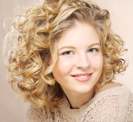Image of beautiful young woman with curly hair