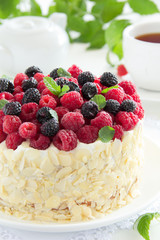 Sponge cake with cream and raspberries.