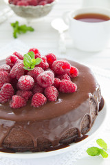 Chocolate cheesecake with raspberries.