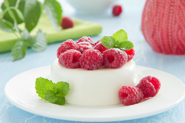 Vanilla panna cotta with raspberries.