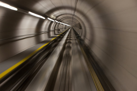 Moving Fast Through A Modern, Conrete Tunnel