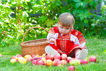  little girl with a basket of apples